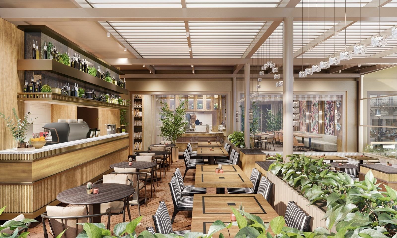 Emirgan Sutiş restoranının ahşap masalı, bitkilerle döşeli iç mekânı